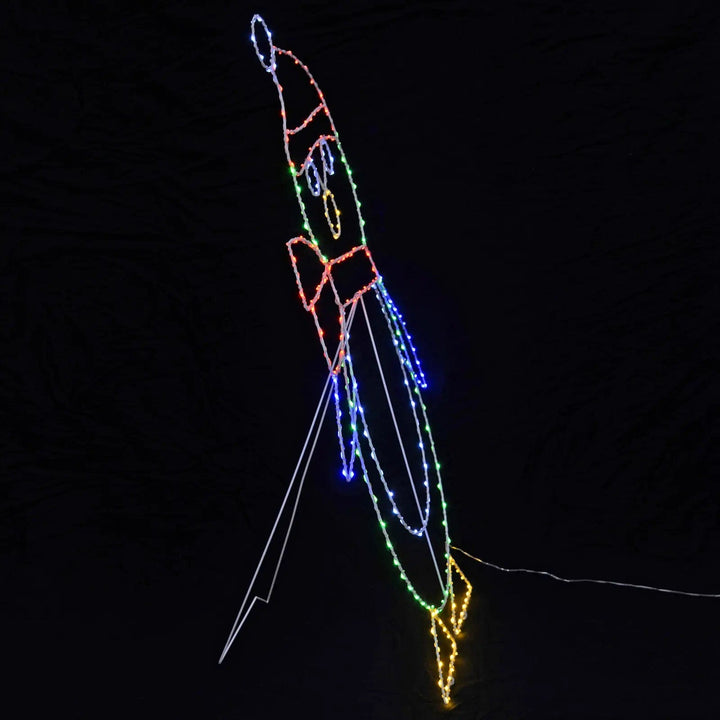 Side view of a large Christmas penguin outdoor light decoration with stand