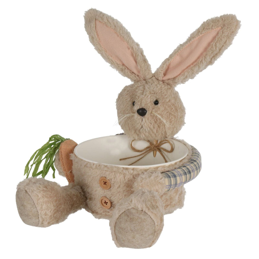 Plush rabbit with a bowl on a white background
