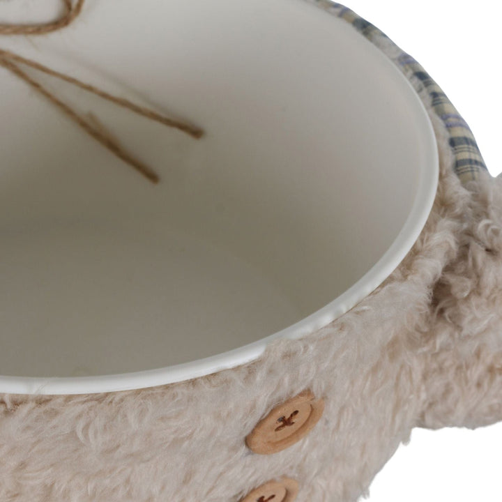 top view of buttons and plastic bowl on white background