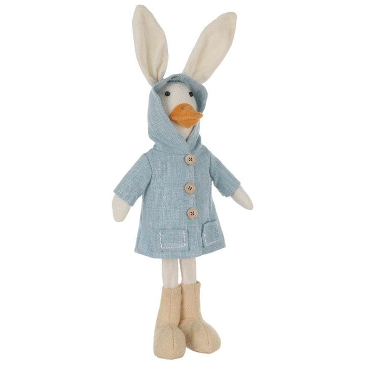 Stuffed toy with rabbit ears wearing a blue coat on a white background