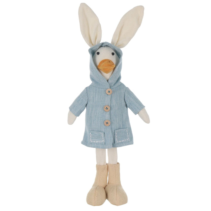 Stuffed duck figure with bunny ears wearing a blue coat on a white background