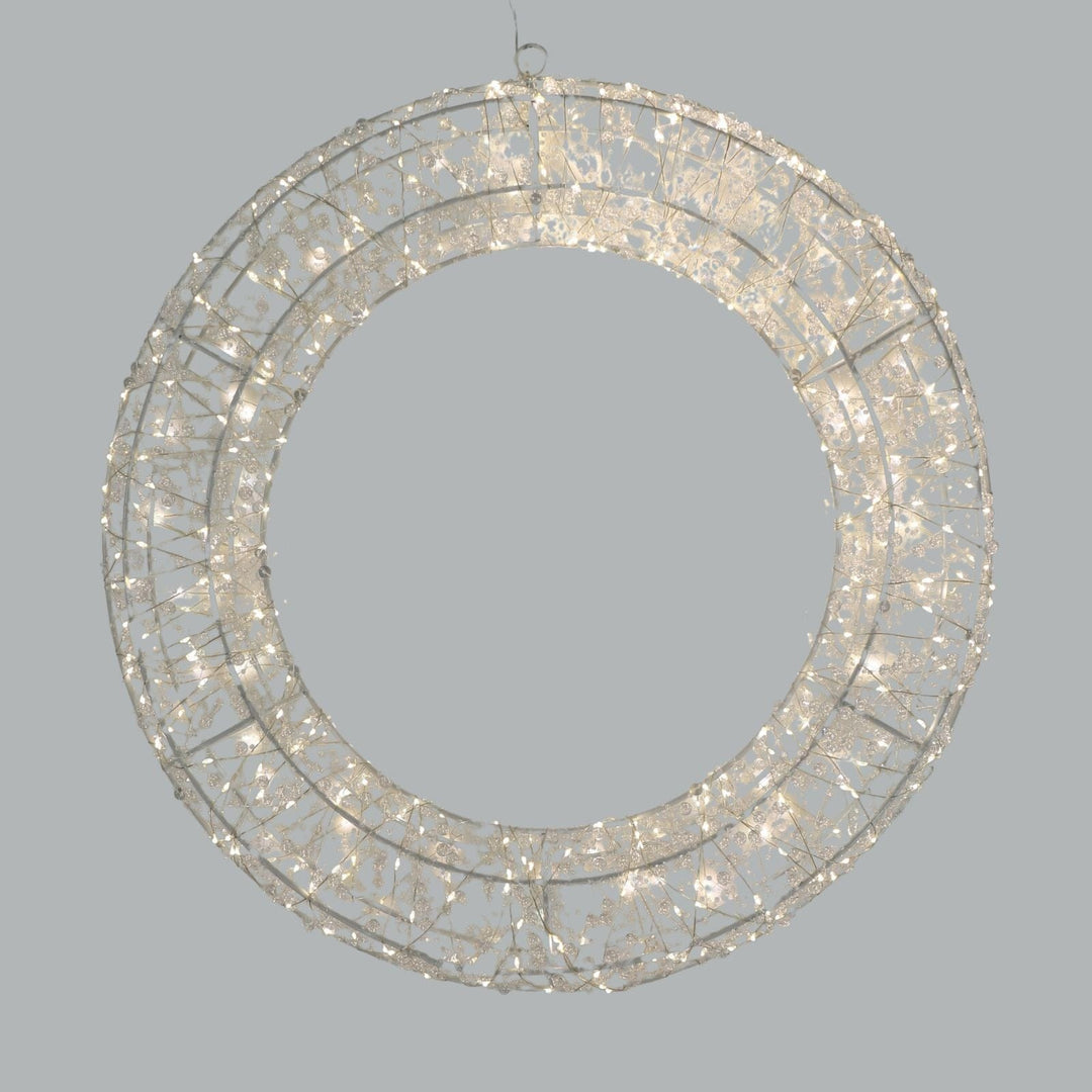 circular chandelier style wreath with warm white lights and beads