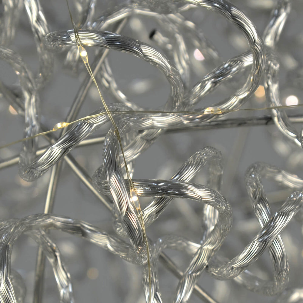 Close up of white LED lights on a a twisted aluminium frame Christmas decoration