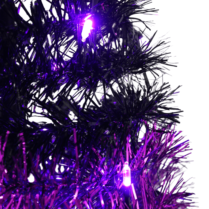 close up shot of black and purple tinsel with lights