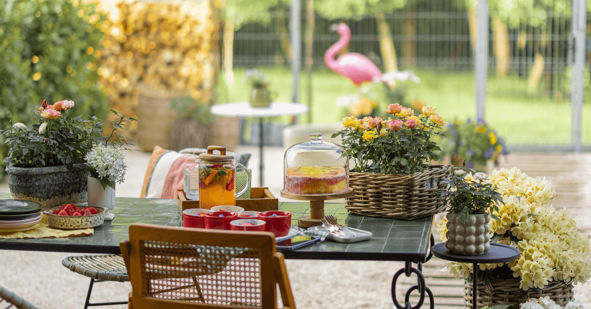 brown rattan 4 seater sofa set in garden space with parasol for shade