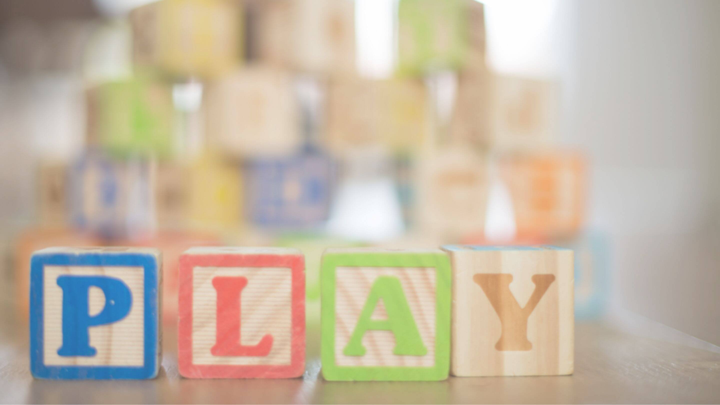 Building blocks with 'Play' spelled out in bold letters
