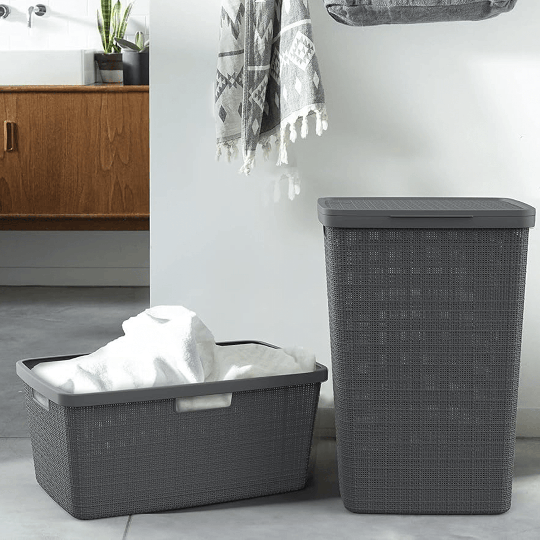 woven lauundry hamper and basket in bathroom space with towels inside