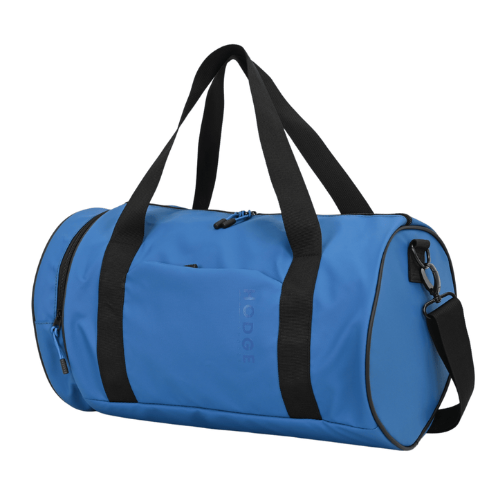 side view of blue hodge and hodge duffle back with black carry handles and zip pulls