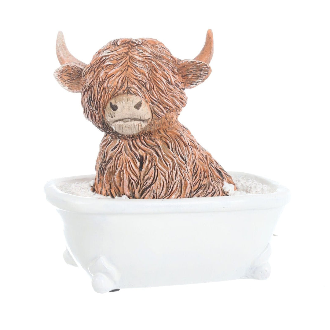 little happy highland cow ornament inside a bath tub with bubbles