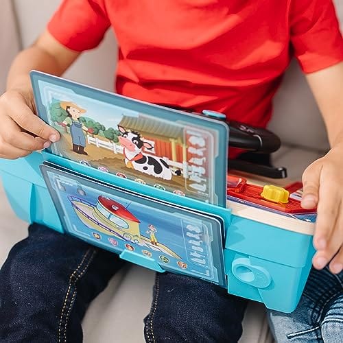 little boy inserts mission card into top of dashboard with 2 additional cards stored at the back