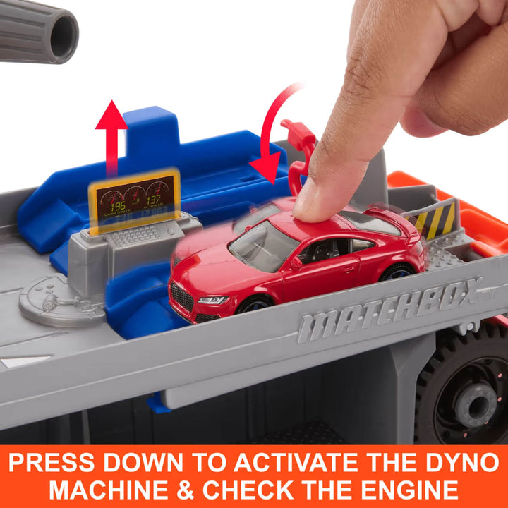Finger pressing down on the car to reveal the diagnostic machine 