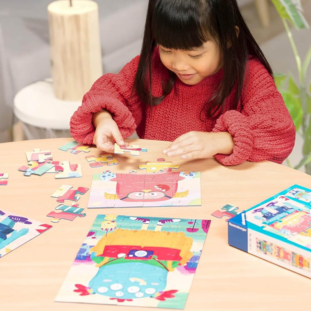 Girl completing a monster design jigsaw puzzle