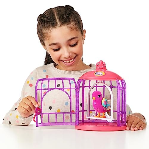 Girl playing with a toy birdcage with pink bird inside