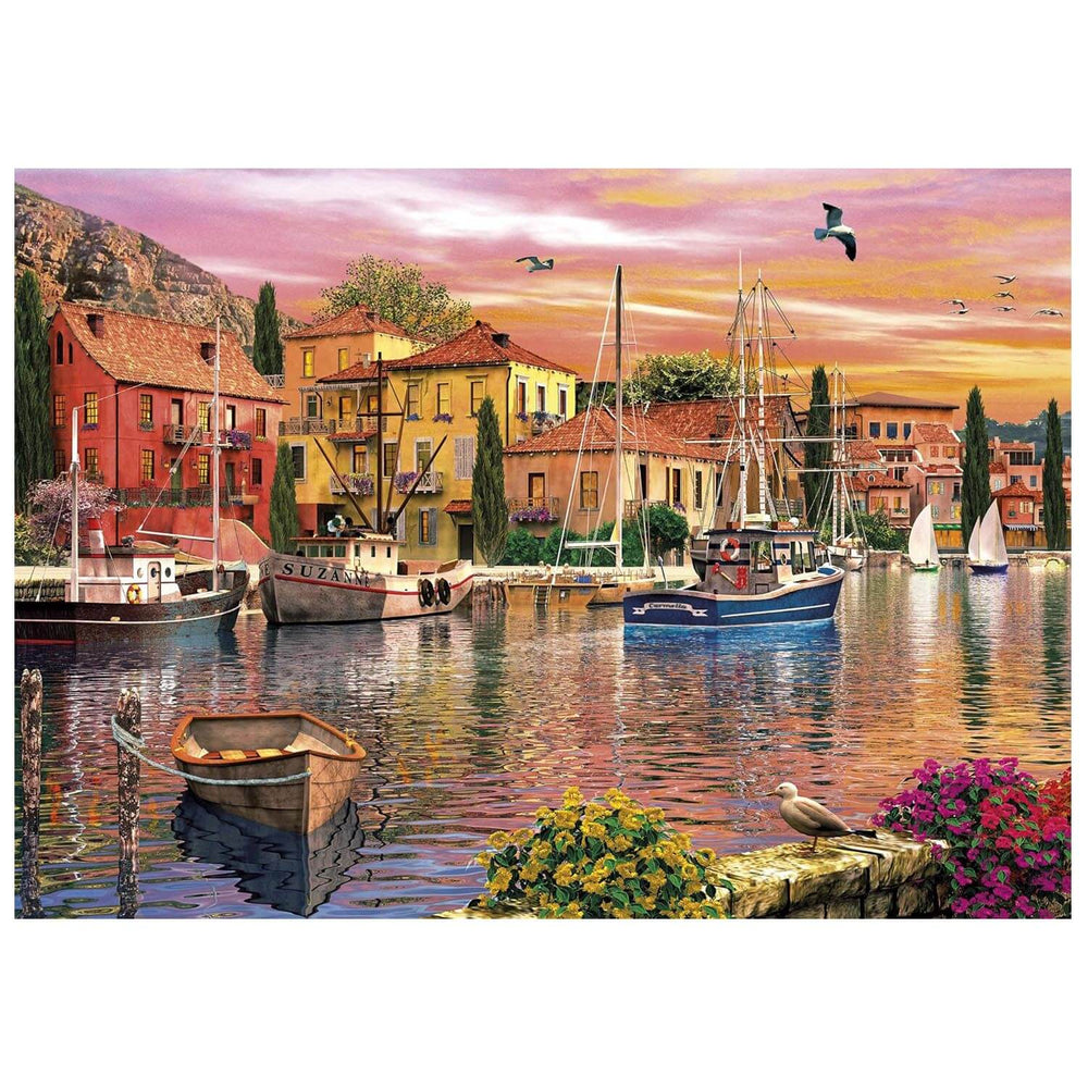 Sunset over a river with buildings boats and seagulls