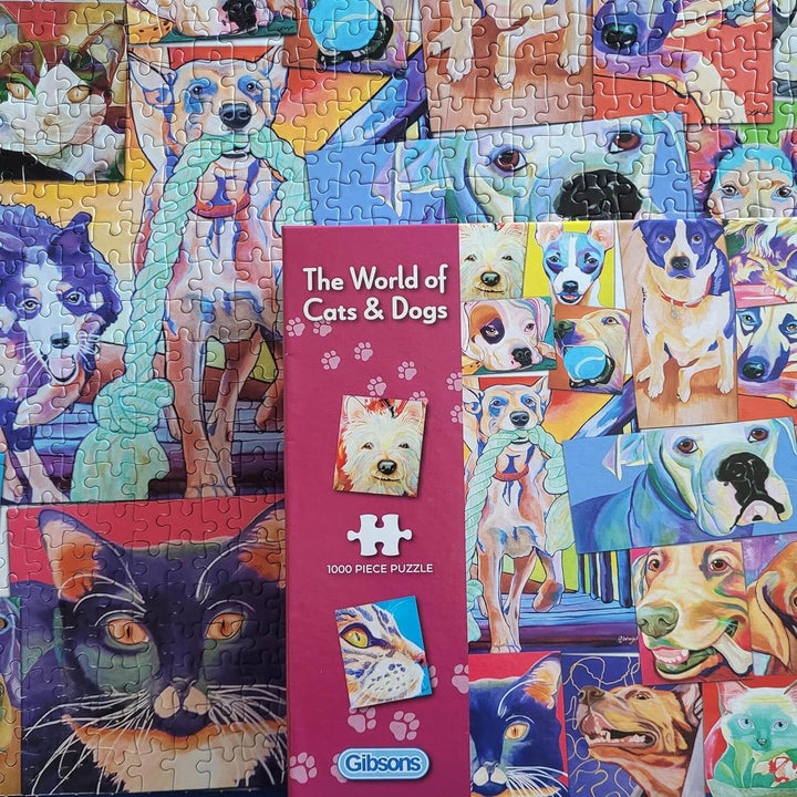 Close up of the box and part of a completed cats and dogs jigsaw puzzle