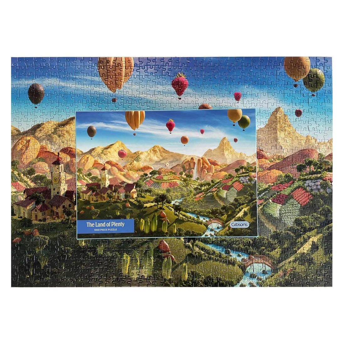 Completed food landscape jigsaw puzzle with box sitting on top