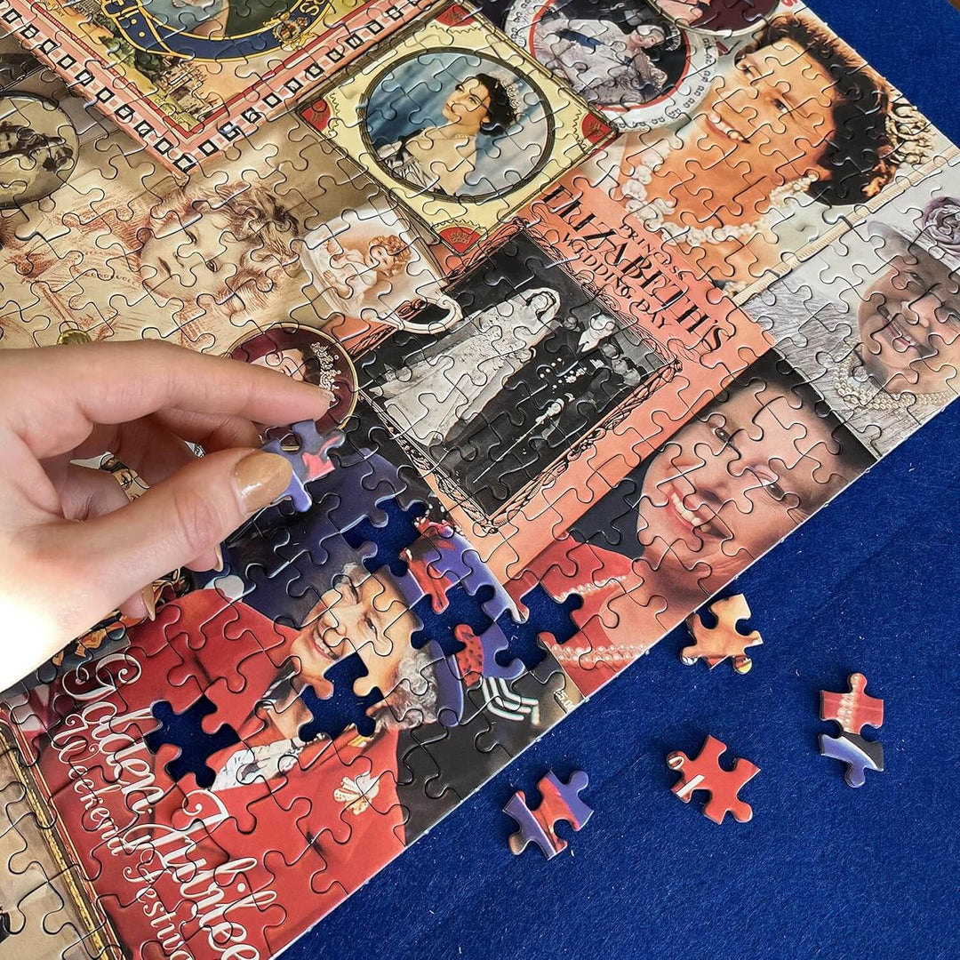 Hand placing a jigsaw piece into a puzzle of the queen