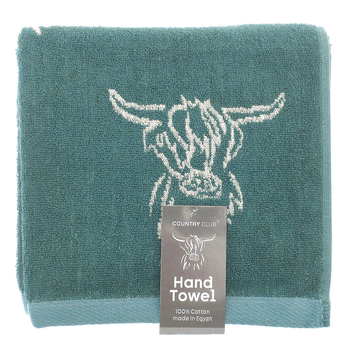 Teal hand towel with cow design and &