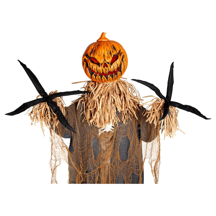 Scary pumpkin scarecrow Halloween decoration with long black fingers