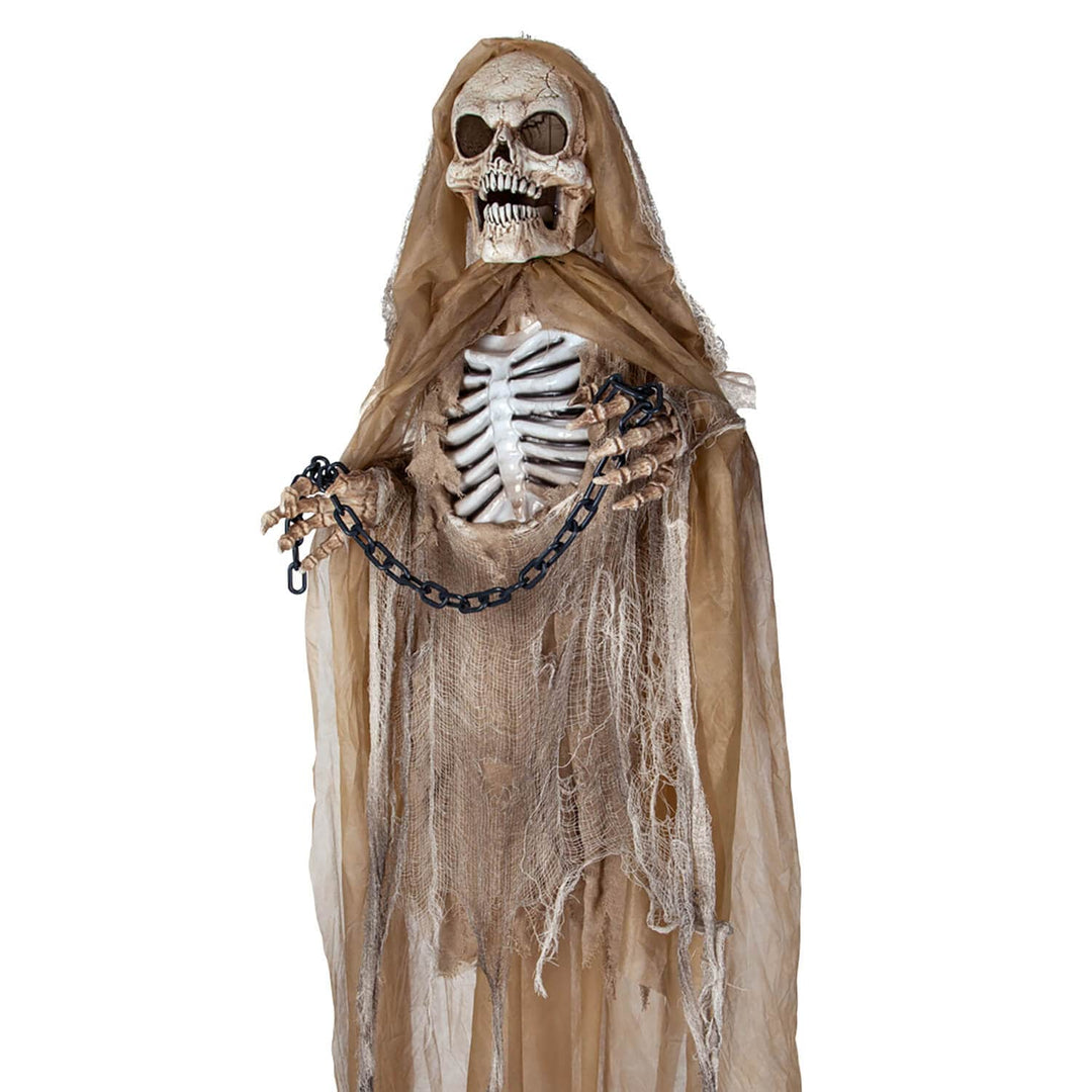 Close up of a hanging Skeleton with hands in chains for Halloween