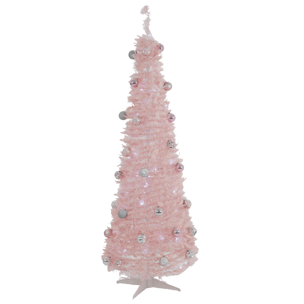 Pink artificial Christmas tree with decorative ornaments on a white background