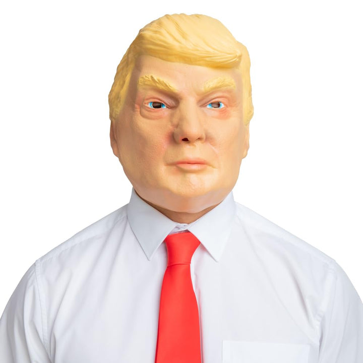 Person wearing a Donald Trump mask with blonde hair, white shirt and red tie