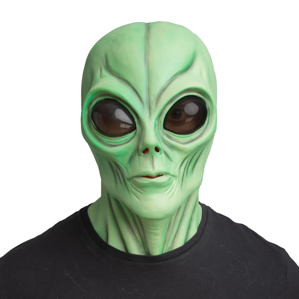 Green alien mask with dark tinted eyes worn by a person on a white background