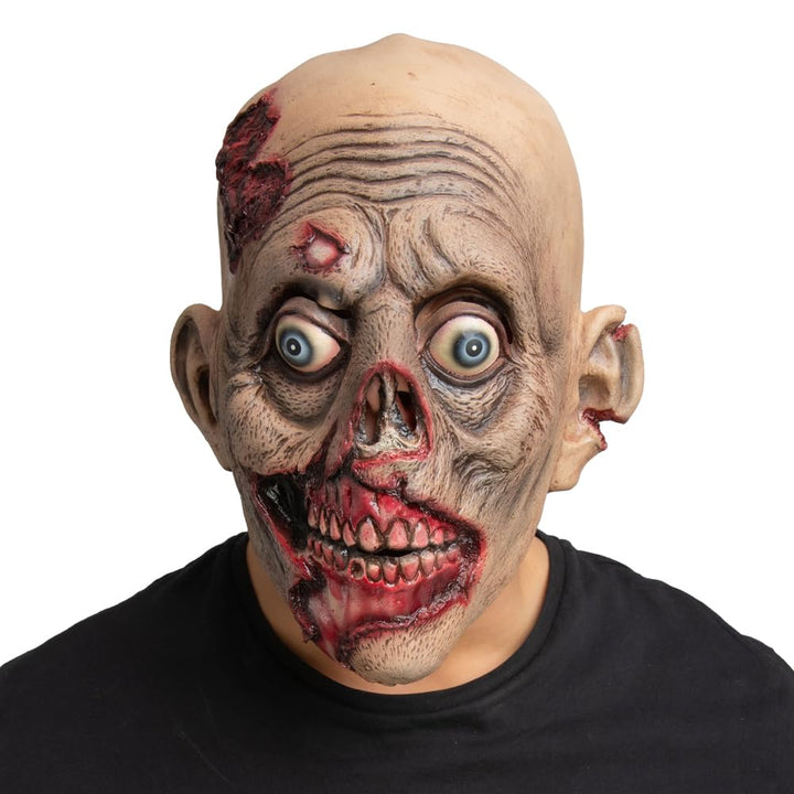 Person wearing a bloody wounded zombie mask with a black shirt on a white background