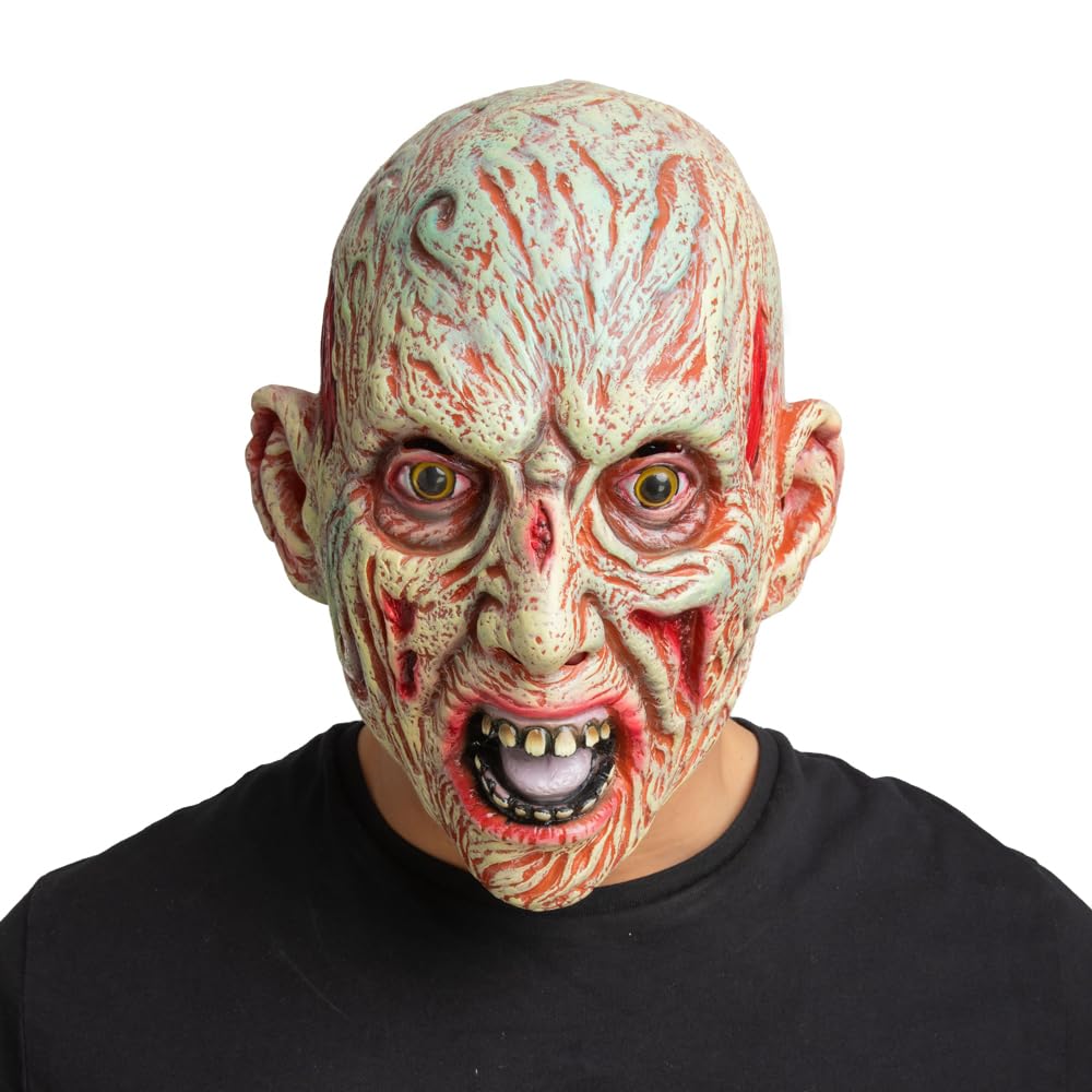Person wearing a detailed burned man zombie mask with a white background