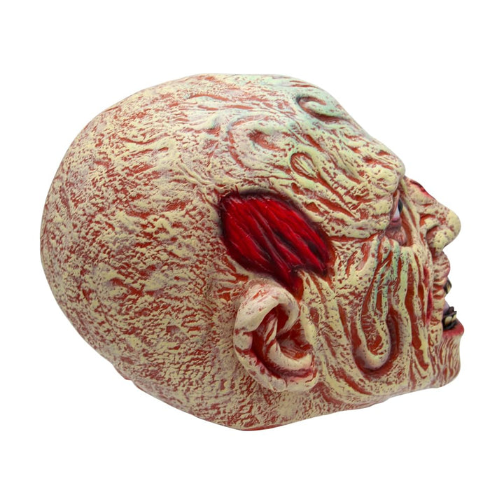 A horror mask featuring burned skin with red decay effects and a bright red ear opening, shown on a plain white background.