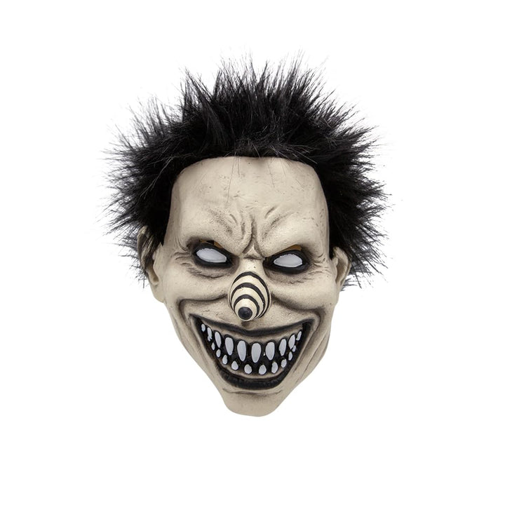 A scary clown mask with a pale, wrinkled face, a wide grin showing sharp teeth, a striped nose, and wild black hair, isolated on a white background.