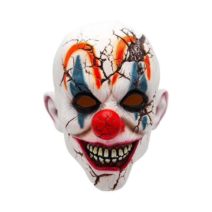 Scary clown mask with cracked white skin and big red nose on a white background