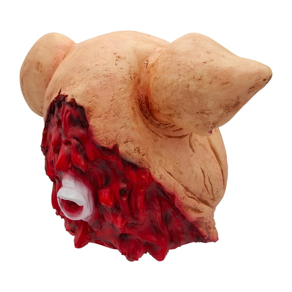 Back of a pig head mask showing red flesh and spine bone