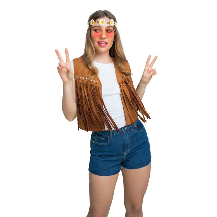 Person wearing a retro-style outfit with a brown fringe vest, white shirt, blue shorts, and flower crown on a white background.