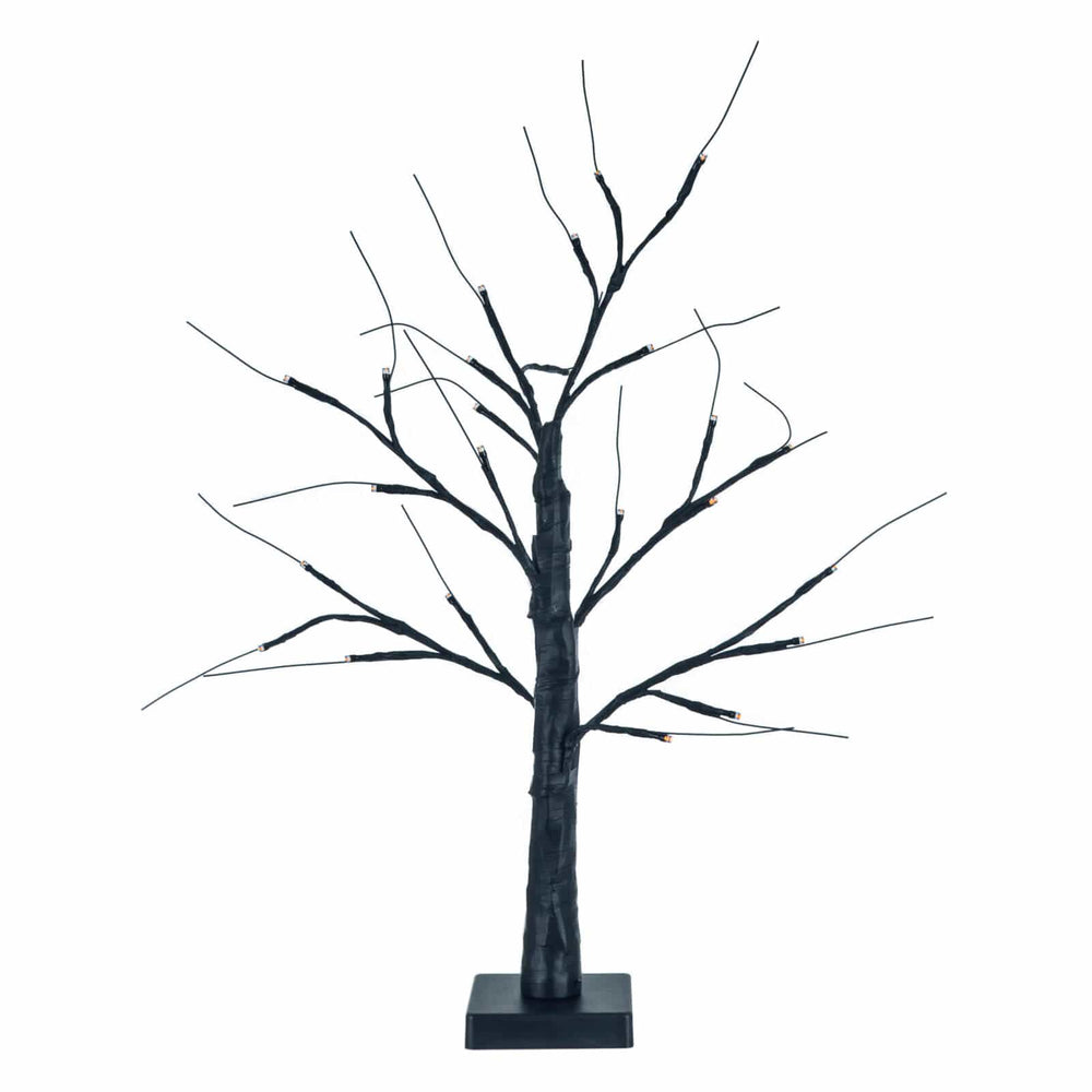 Decorative black Halloween mini twig tree with orange lights on a white background
