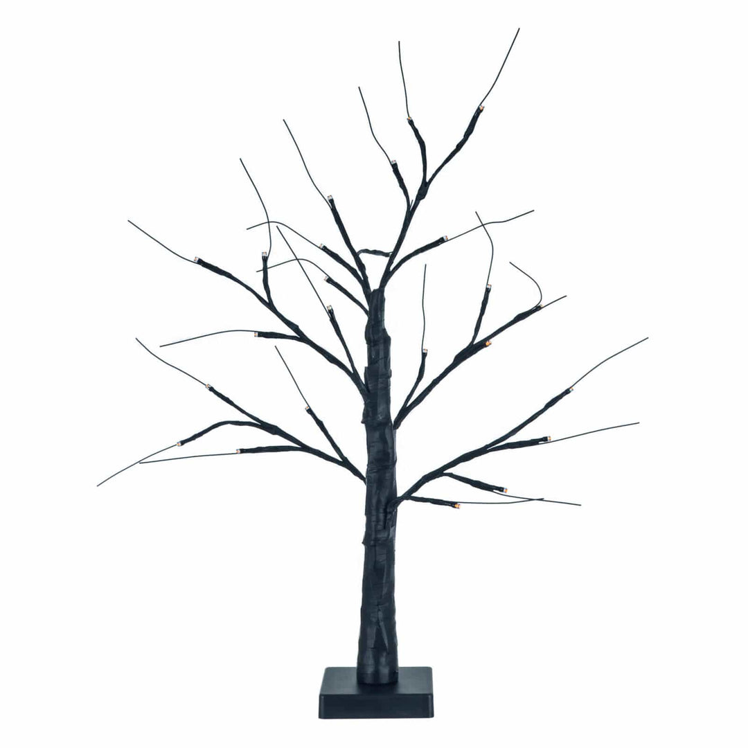 Decorative black Halloween mini twig tree with orange lights on a white background