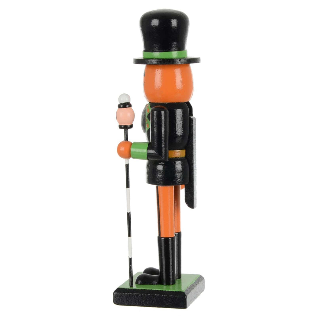 Side view of a black and orange Halloween nutcracker soldier decoration