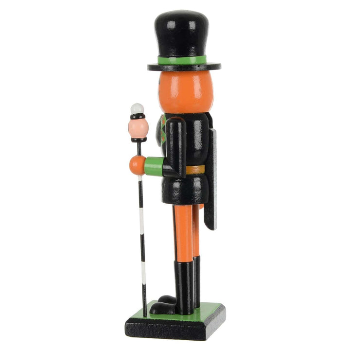 Side view of a black and orange Halloween nutcracker soldier decoration
