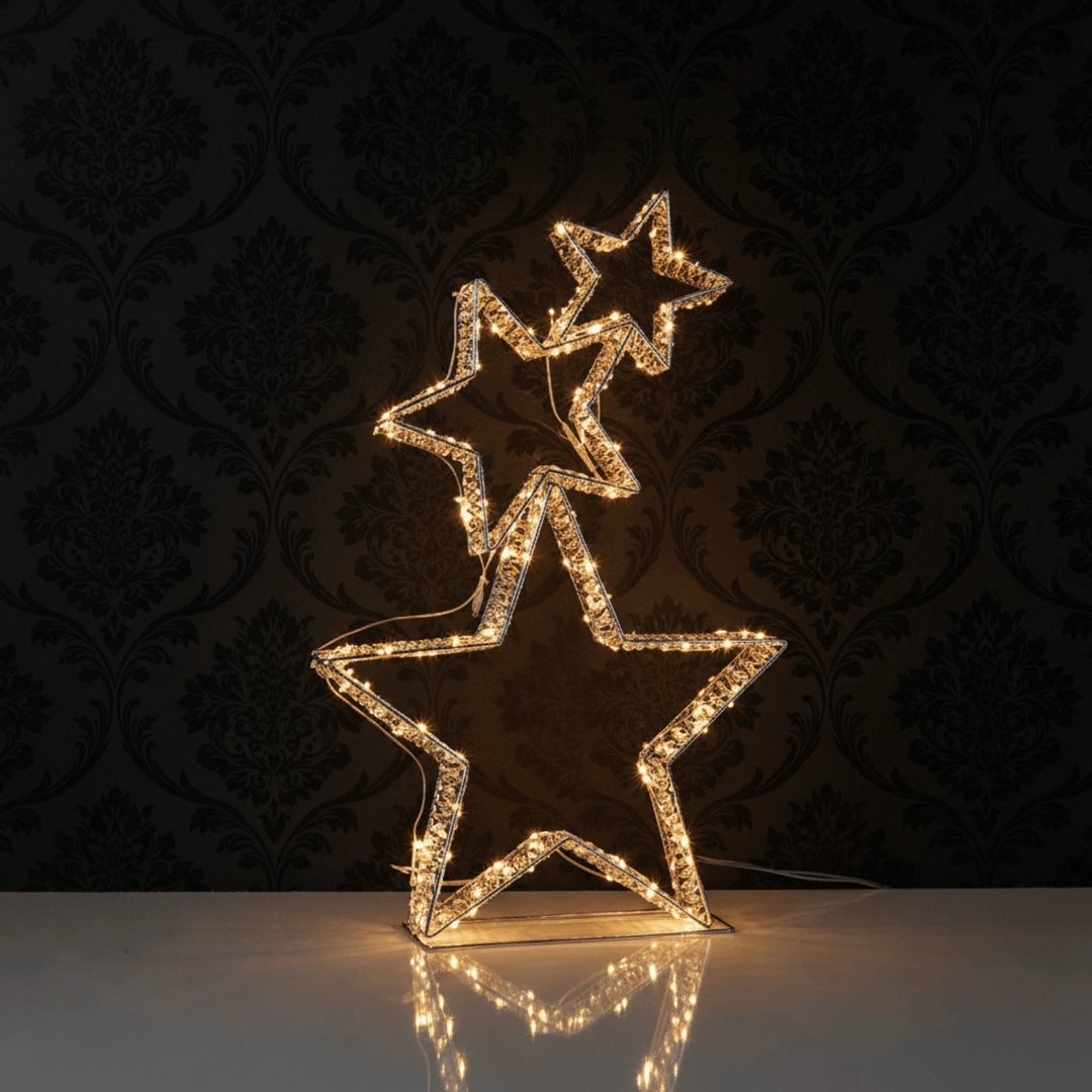 Decorative star-shaped light fixture on a reflective surface with a dark patterned background