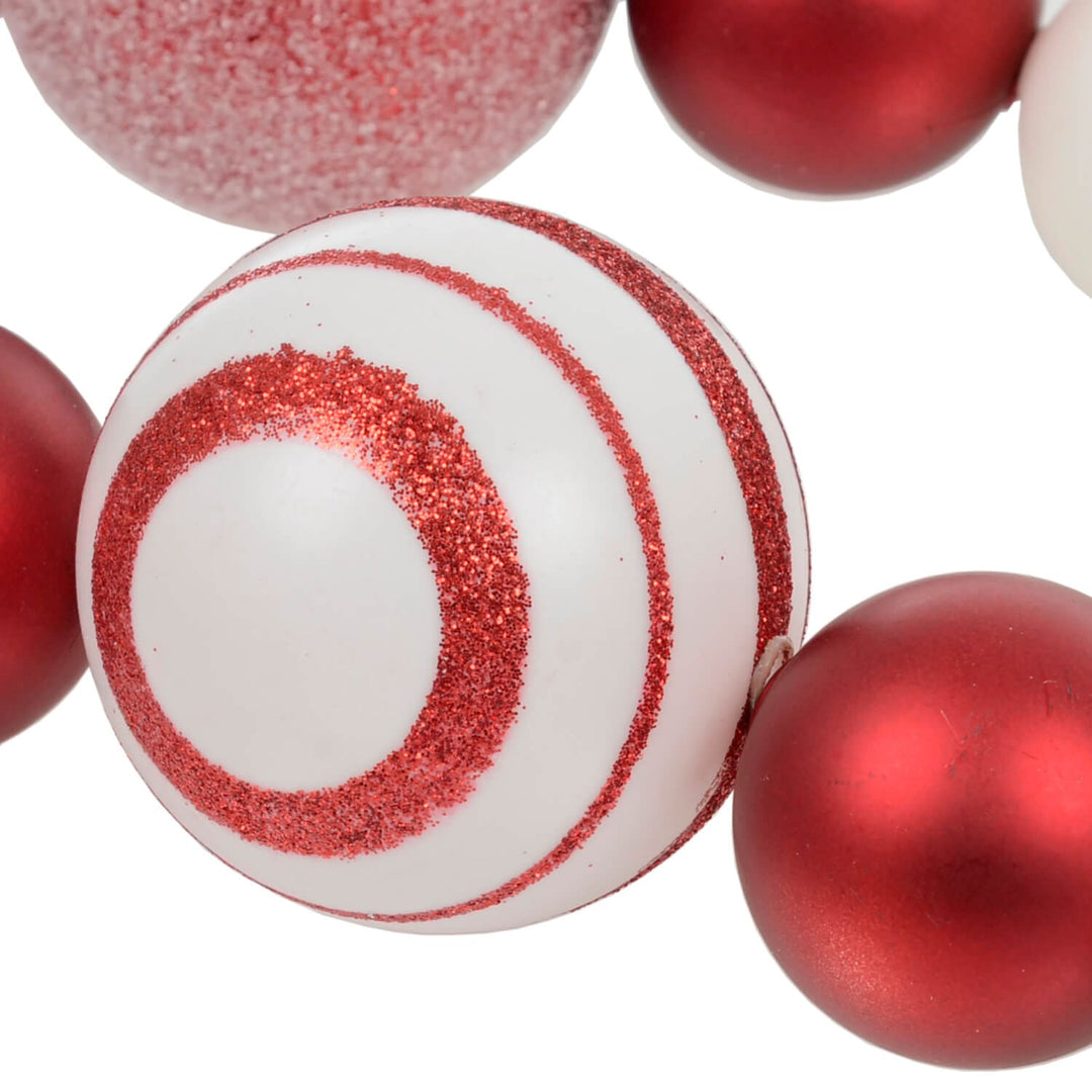 Close up of red and white striped Christmas bauble