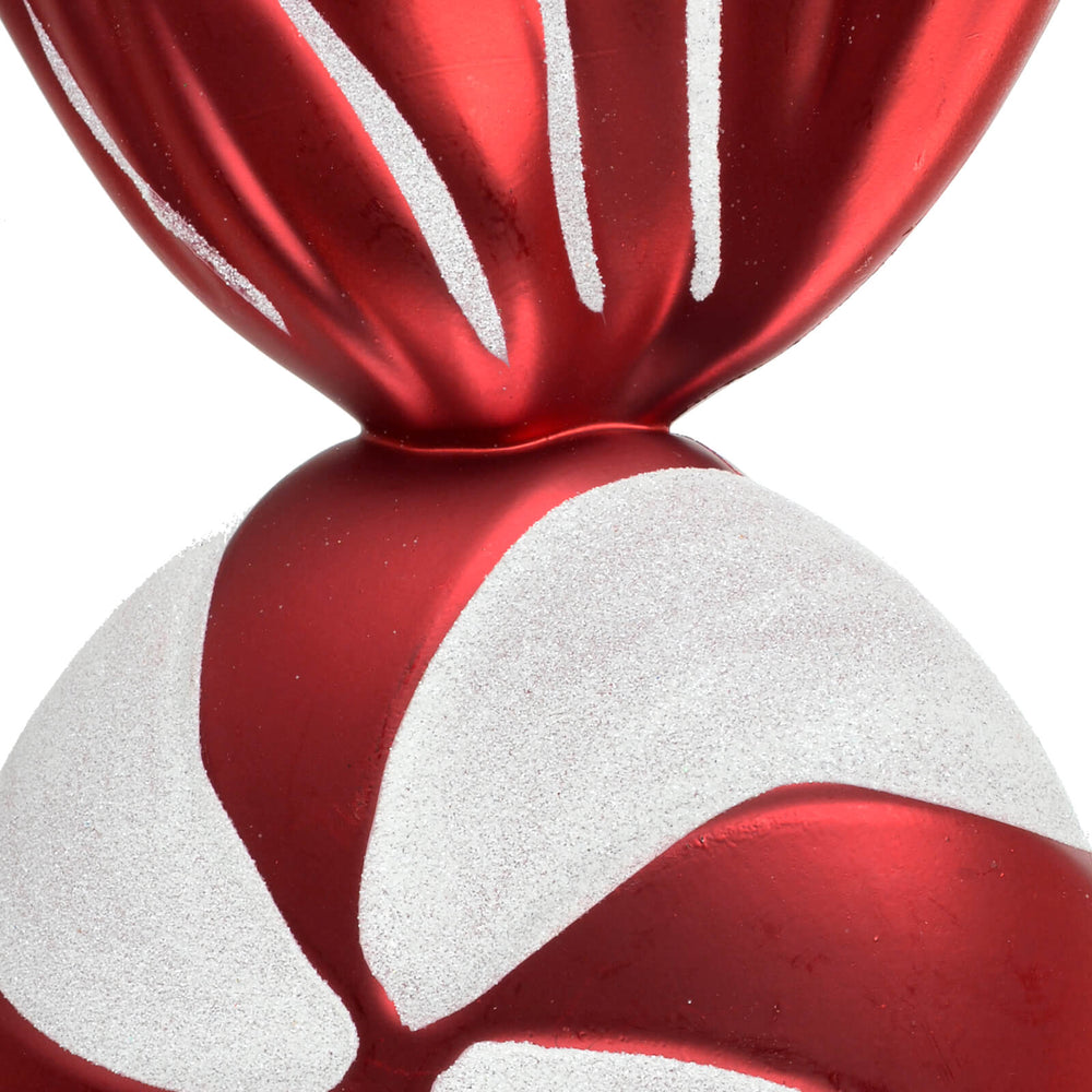 CLose up of the white glitter and red striped Christmas candy tree decoration