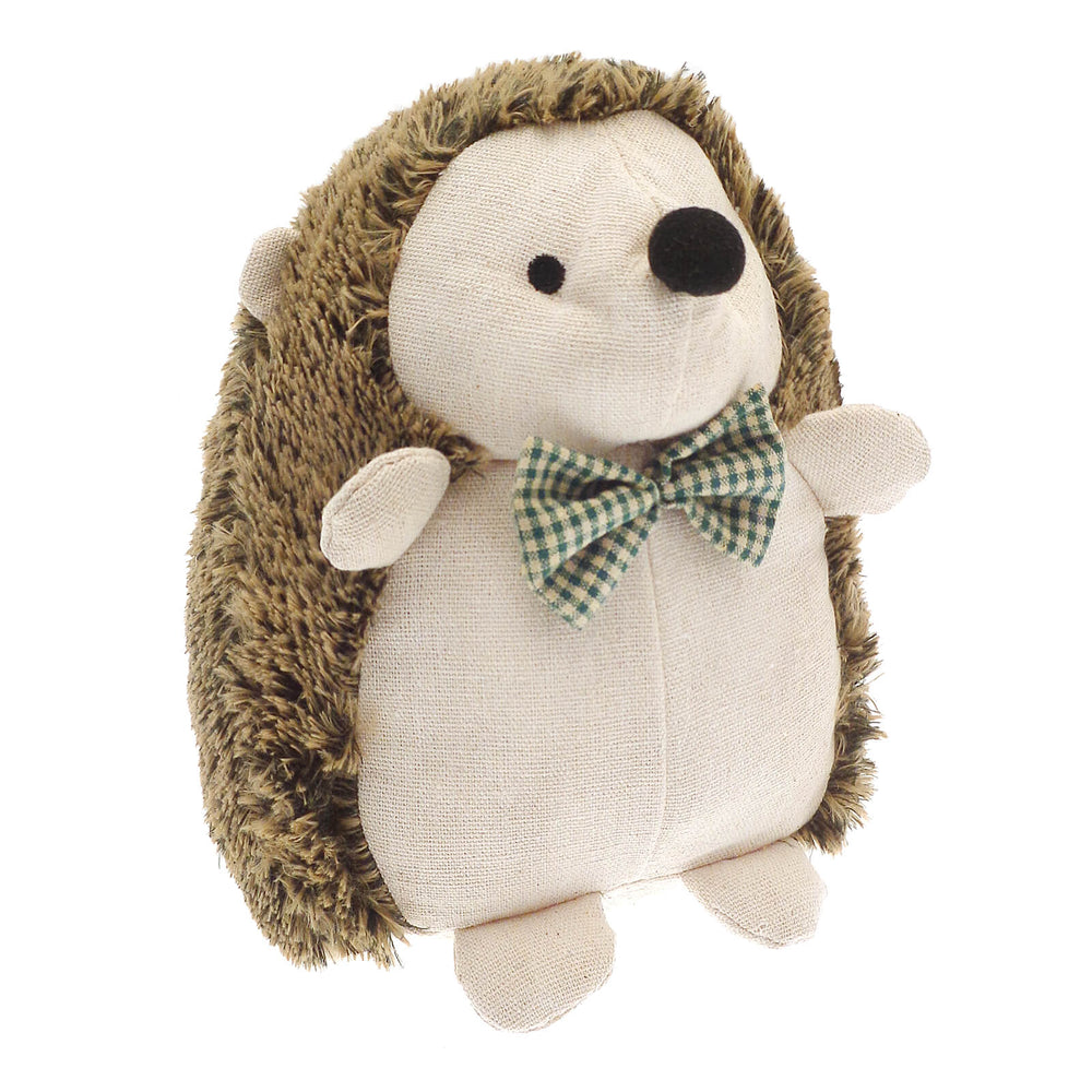 Plush hedgehog door stopper with a bow tie on a white background