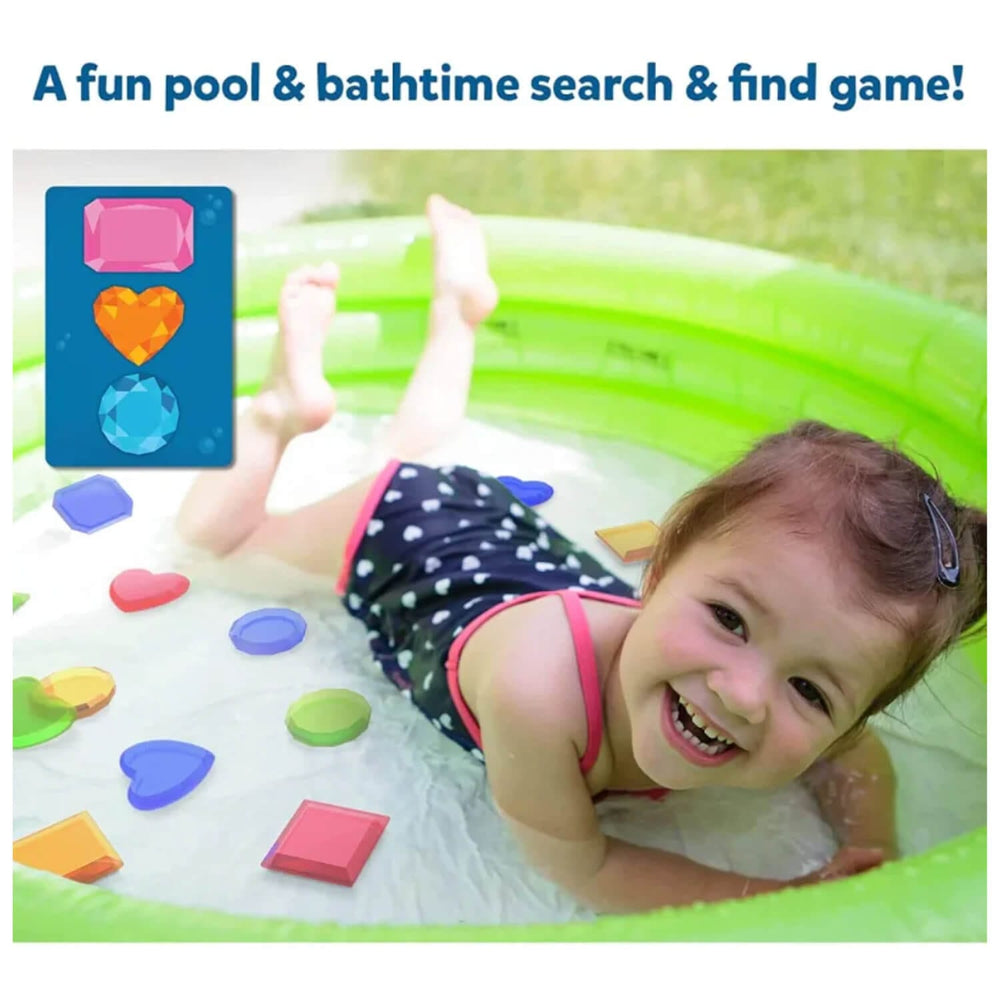 Girl in a paddling pool with gem hun game pieces