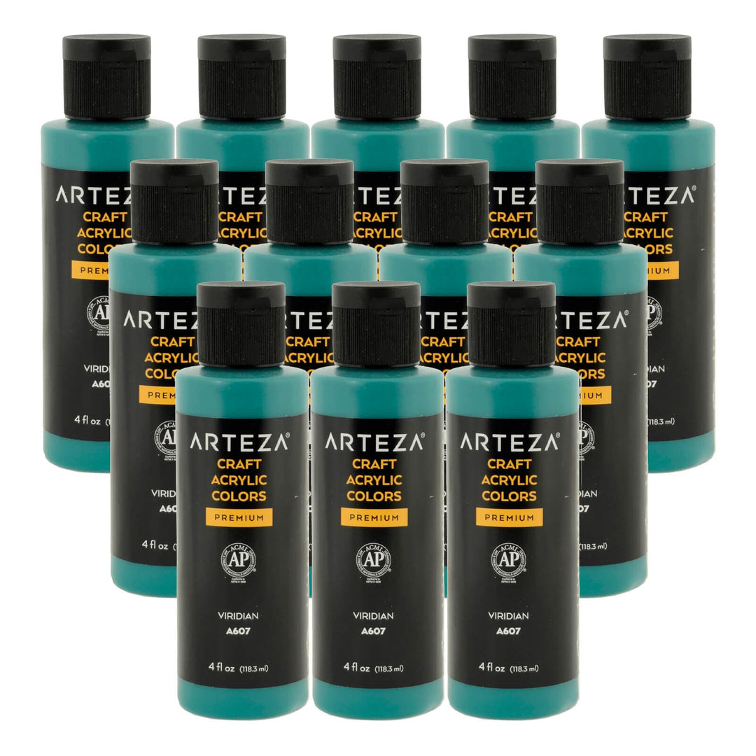 12 bottles of blue green acrylic paint on a white background