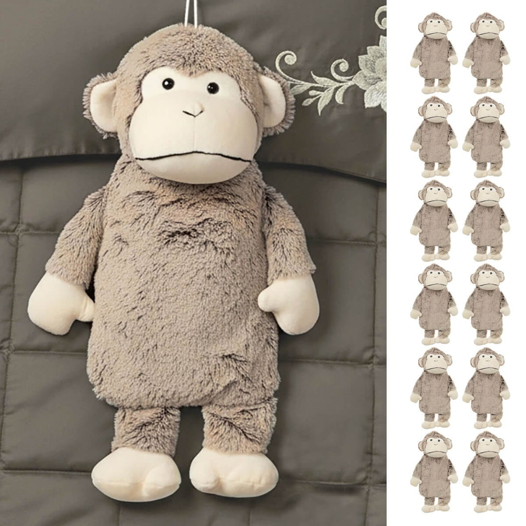 Monkey hot water bottle with plush 3D cover on a bed
