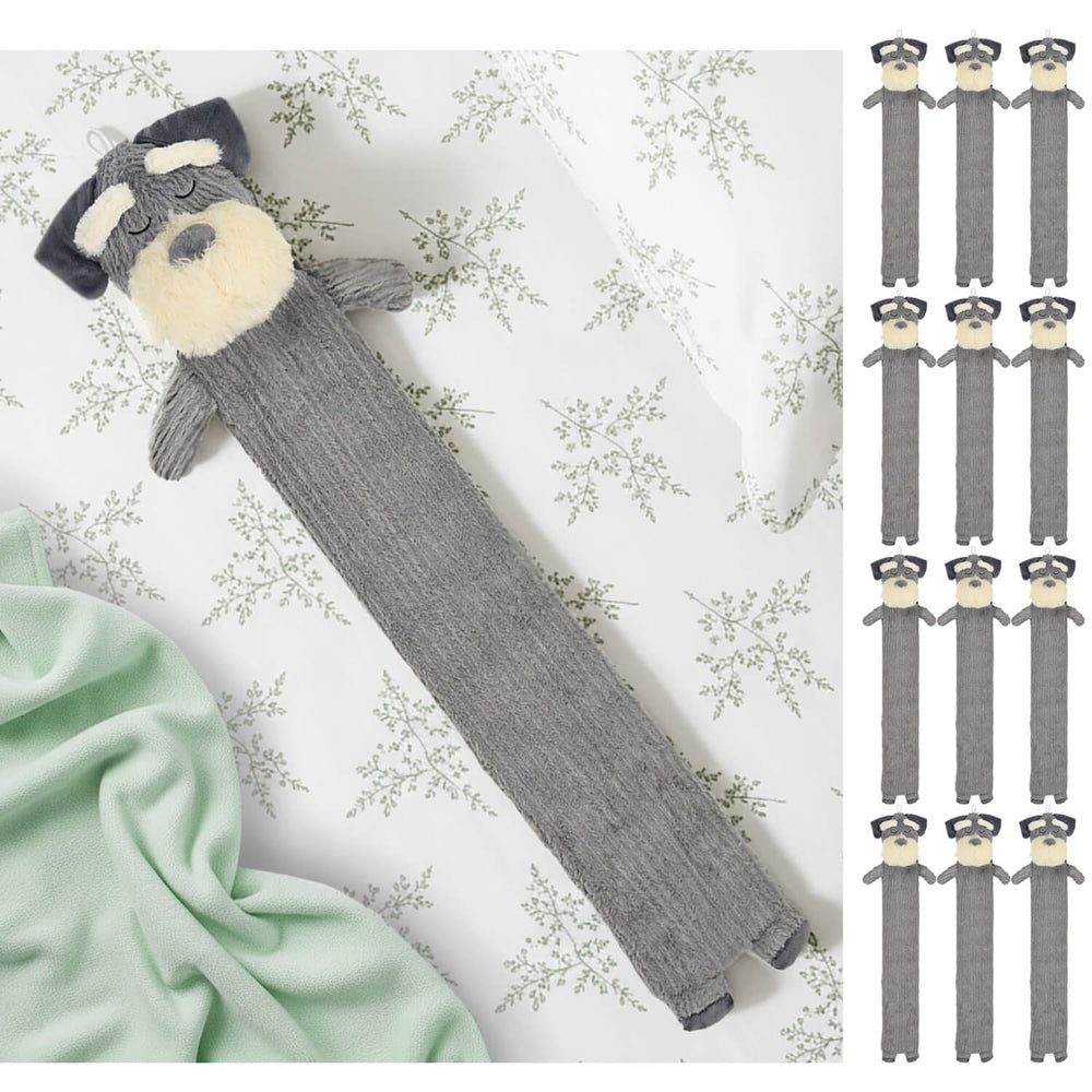 Long plush dog hot water bottle on a fern bed sheet with green blanket