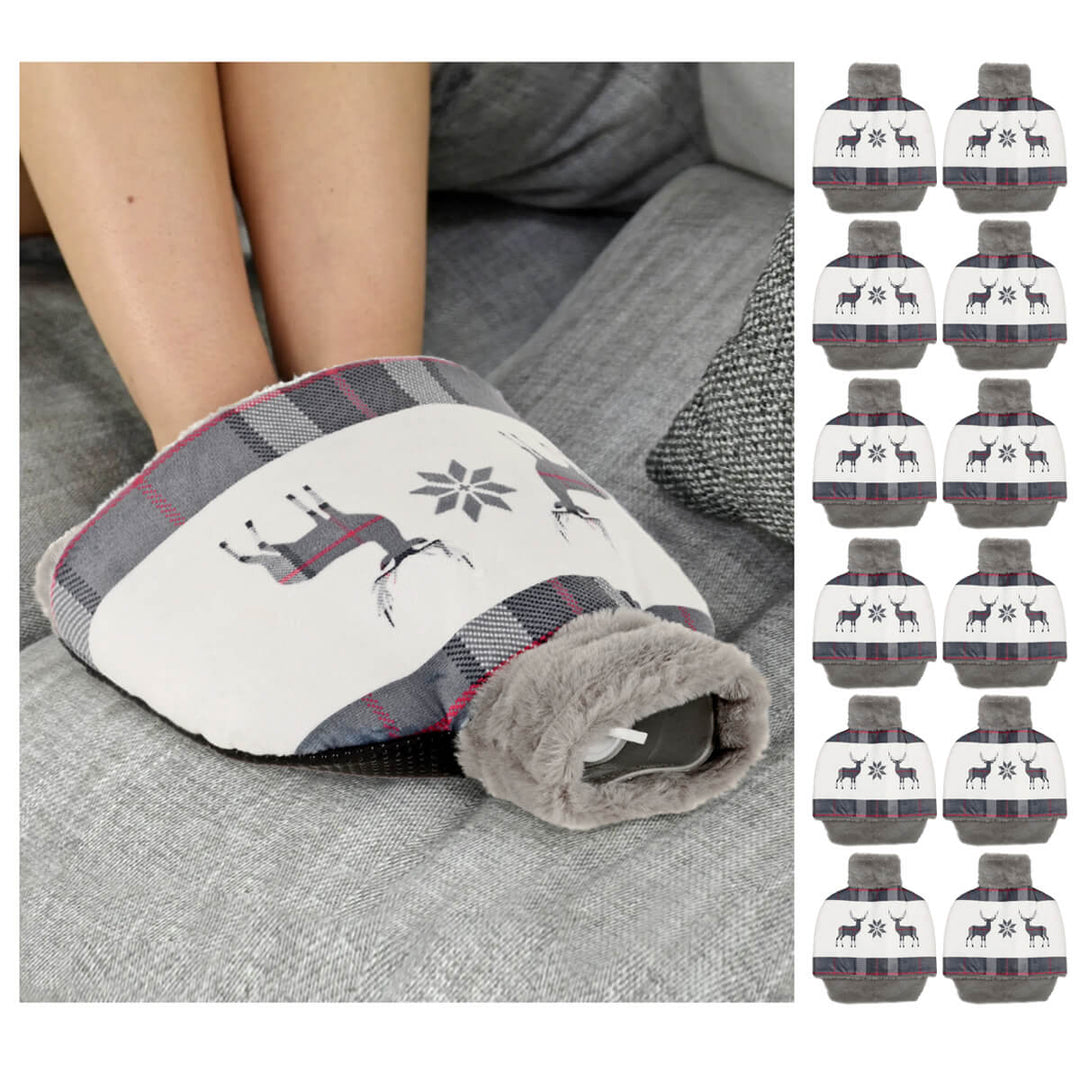 Grey and white Christmas reindeer foot warmer hot water bottle shown on a person's feet on a sofa.