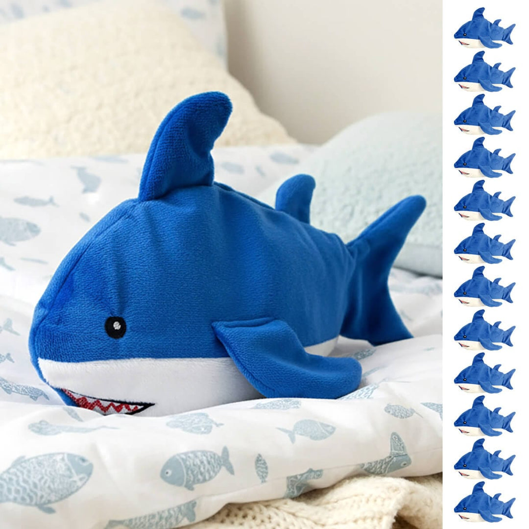 Blue shark plush shark heat pad on a fish printed quilt with fleece pillows