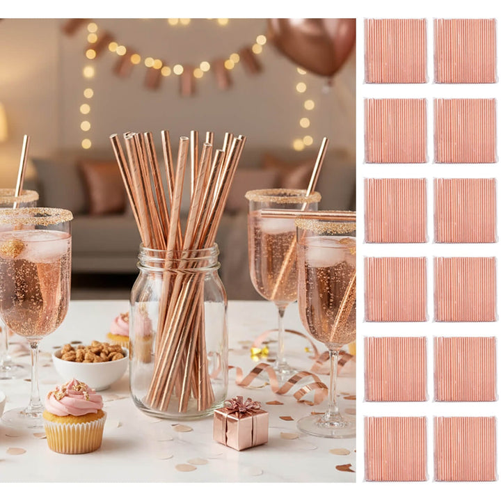 Rose gold straws in a jar with glasses of champagne, cupcake, and small gift on a festive table.