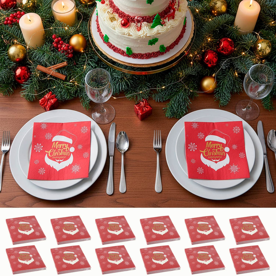 Christmas-themed table setting with a cake, candles, and red 'Merry Christmas' Santa napkins.